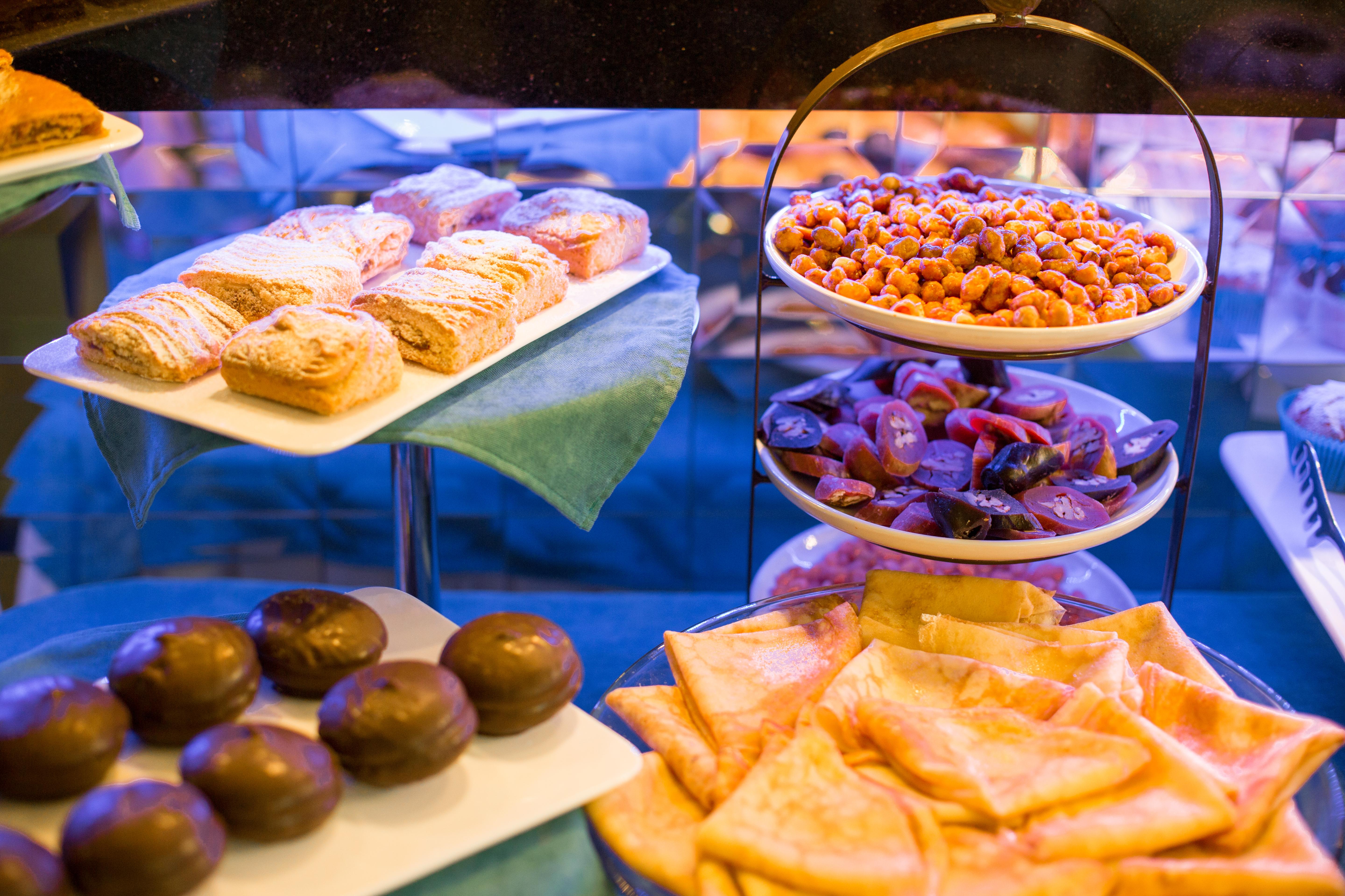 River Side Hotel Tbilisi Exterior photo A display of pastries and other snacks at a bakery in Madrid, Spain